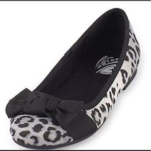 Children place girls shoes